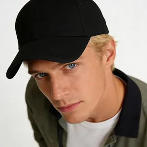 Classic black hard top baseball cap for large heads worn by a professional male model