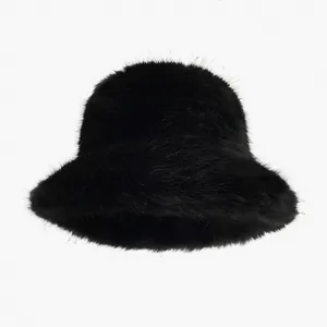 Detail shot of the plush black faux fur texture on a stylish women's winter bucket hat