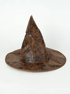 Close-up detail of vintage brown cracked-leather texture witch hat for Halloween costumes