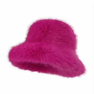 Vibrant fuchsia pink faux fur bucket hat with soft plush texture for winter fashion