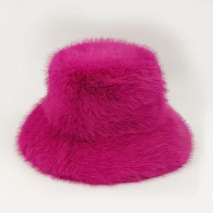 Detailed view of vibrant magenta faux fur texture on a stylish winter bucket hat for women