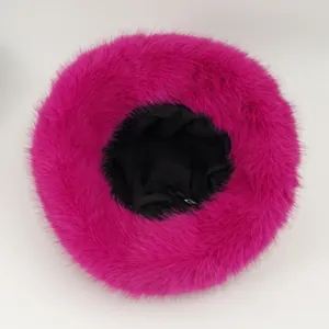 Detailed top view of a vibrant fuchsia plush bucket hat showing soft fluffy texture
