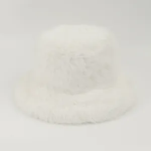 Detail showing the fluffy and soft white faux fur texture of a stylish winter bucket hat