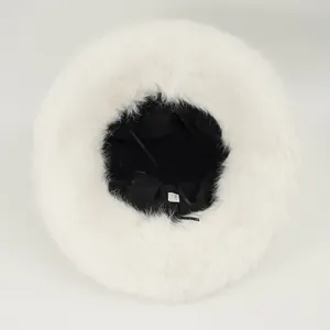 Inside view of white faux fur bucket hat with soft lining and adjustable strap