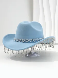 Detail shot of a light blue women's cowboy hat with heart gems and elegant rhinestone tassels.