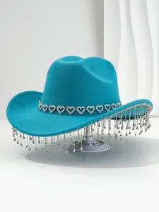 Detailed view of teal cowboy hat with heart rhinestones and sparkling crystal tassels