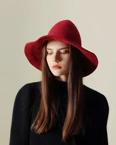 Detail shot of a deep red knitted pointed witch hat for Halloween parties.