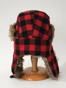 Rear view of a red and black plaid trapper hat with faux fur trim