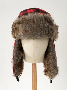 Detailed front view of winter plaid trapper hat with faux fur on a display stand