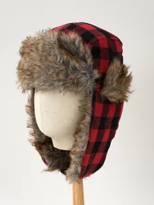Close-up of red and black plaid trapper hat with warm faux fur lining details