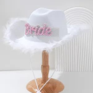 Elegant white bride cowboy hat featuring feather trim and pink pearl Bride letter design.