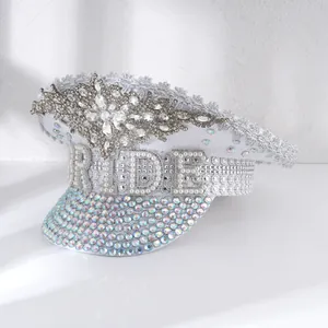 Detailed view of white bride captain hat with rhinestone and pearl embellishments