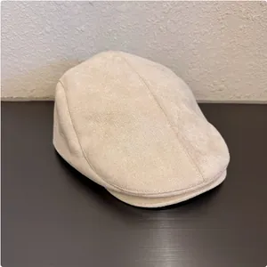 Detailed view of a stylish vintage beige suede ivy cap for a minimalist retro look