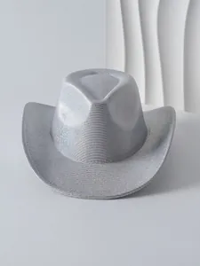 Close-up of stylish silver metallic cowboy hat with shimmering textured finish