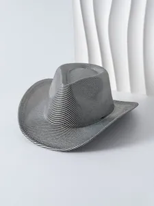 Macro view of a stylish metallic silver women's cowboy hat featuring a fine woven texture.