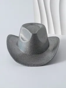 Detail of silver metallic cowboy hat with textured grid pattern and wide brim