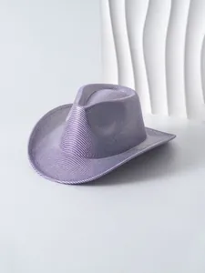 Detailed view of a purple shimmering women's cowboy hat featuring a metallic texture