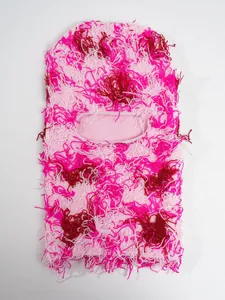 Detailed view of the fuzzy pink distressed knit balaclava ski mask for winter warmth