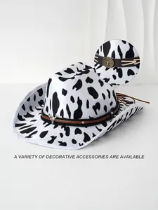 Detailed view of cow print cowboy hat featuring bull head decorative metal buckle