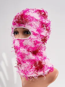 Close-up of a pink distressed camouflage knitted balaclava mask for winter warmth