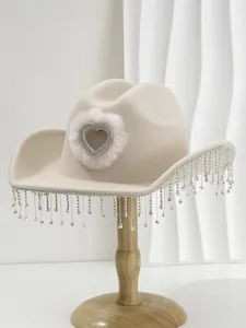 Beige western cowboy hat with rhinestone heart and sparkling tassel fringe details