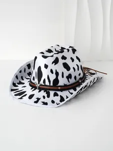 Close-up of cow print cowboy hat with a metal bull head ornament on the band.