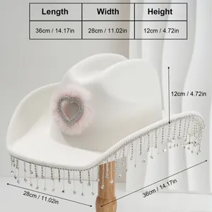 White cowboy hat with pink rhinestone heart and silver tassel fringe detail.