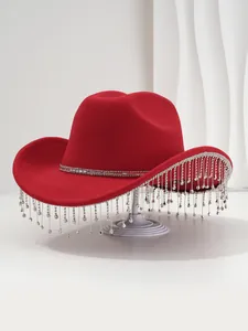 Close-up of elegant red cowboy hat with sparkling rhinestone fringe detail for parties