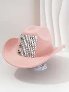 Detailed close-up of pink western cowboy hat featuring large square silver pyramid studs