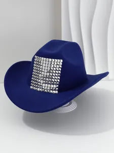 Close-up of blue Western cowboy hat with silver square pyramid studs