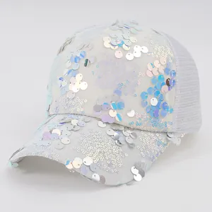 Detailed view of white mesh baseball cap with iridescent sequins for Y2K style.