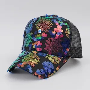 Detailed close-up of vibrant multicolored sequins on a black Y2K retro mesh trucker hat