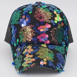 Detailed view of vibrant colorful sequins on a Y2K style black mesh baseball cap