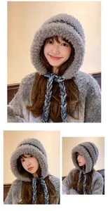 Close-up views of a warm grey plush ear protection hat with stylish blue braided ties