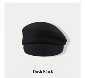Elegant black wool newsboy cap for women in a minimalist French style for autumn and winter.