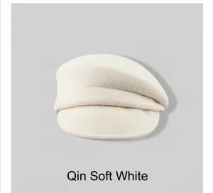 Detailed view of a soft cream white wool newsboy cap for women featuring minimalist French style