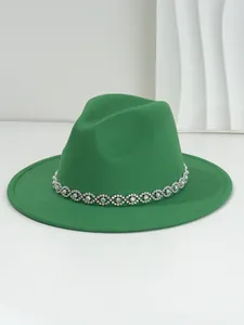 Emerald green fedora hat with a bohemian rhinestone eye-pattern band for parties