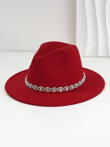 Close-up of red fedora hat featuring a sparkling Bohemian style rhinestone eye band
