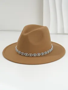 Detailed view of camel wool fedora hat featuring bohemian rhinestone eye band