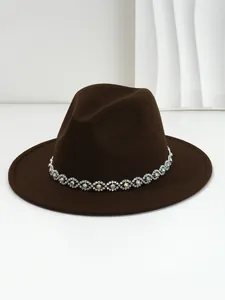 Detailed view of bohemian style rhinestone band decoration on brown wool fedora hat