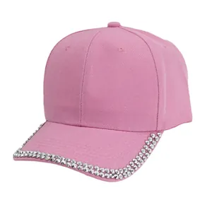 Stylish pink baseball cap featuring decorative silver metal studs on a curved brim