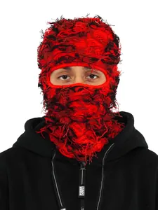Detailed macro view of red and black distressed knitted balaclava ski mask fiber texture