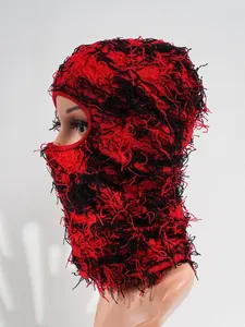 Distressed red and black knitted balaclava ski mask with fuzzy texture for winter warmth.