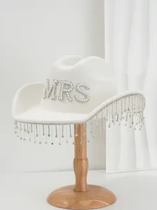 White bridal cowboy hat featuring rhinestone MRS letters and shimmering crystal fringe