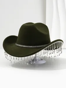 Close-up detail of silver rhinestone fringe and tassels on a dark olive green luxury cowboy hat