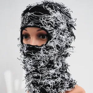 Handmade distressed black and white camouflage knitted balaclava ski mask for winter.