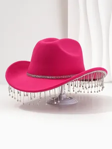 Detailed view of luxury pink cowboy hat with sparkling rhinestone fringe tassels.