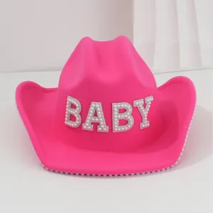 Vibrant hot pink wool cowboy hat with pearl trim and rhinestone BABY lettering
