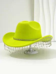 Detailed macro view of lime green cowboy hat with shimmering rhinestone tassel fringe