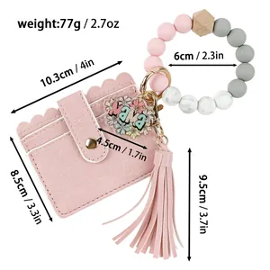 Vue détaillée du porte-cartes rose en PU avec perles en silicone et dimensions.